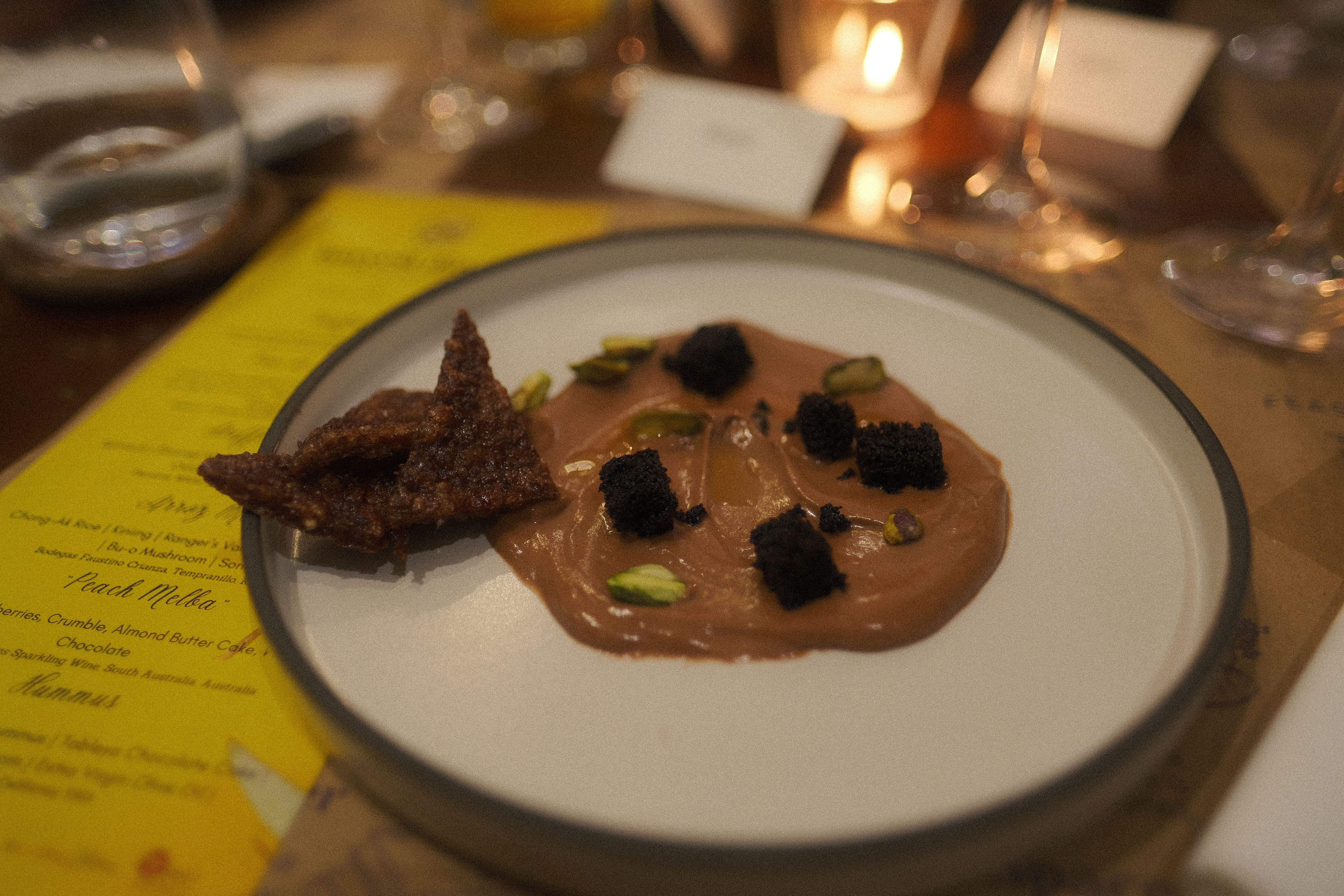The Fatted Calf’s chocolate hummus scattered with pistachios and dark crumble, flanked by shards of caramelized brittle
