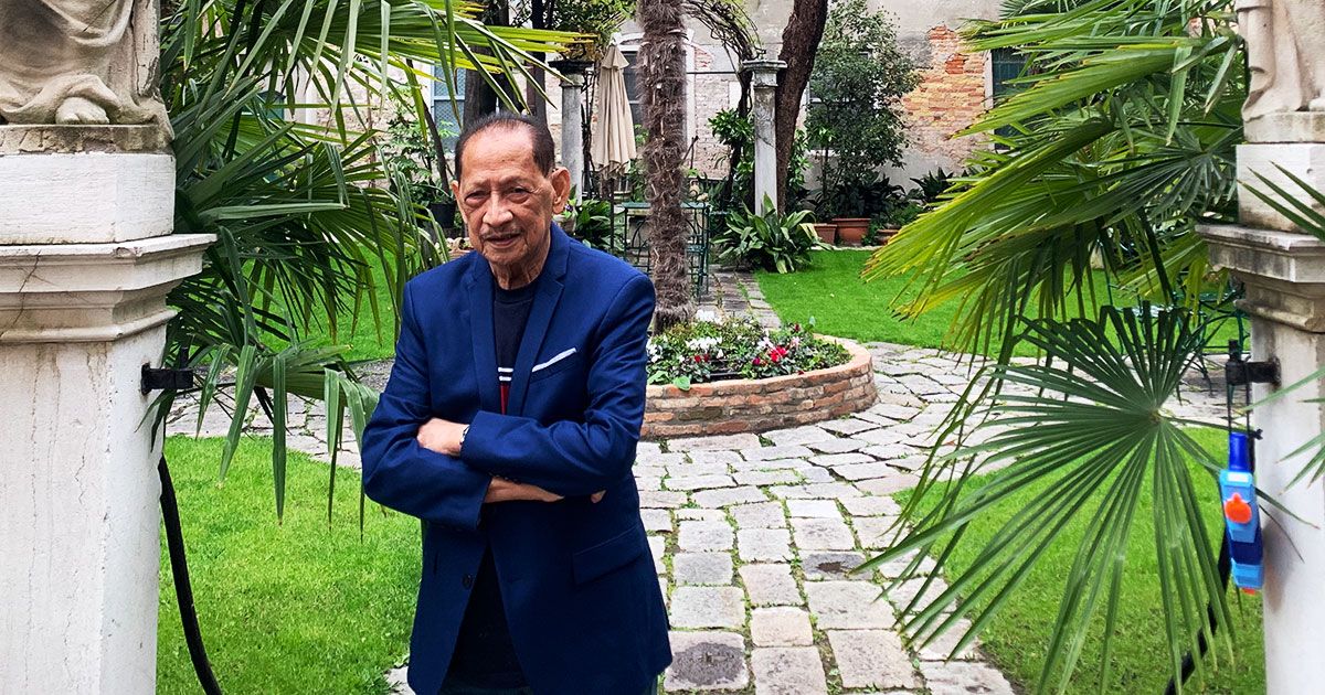 Portrait of NCCA Chairman Nick Lizaso posing in a garden in Venice, wearing a barong Tagalog