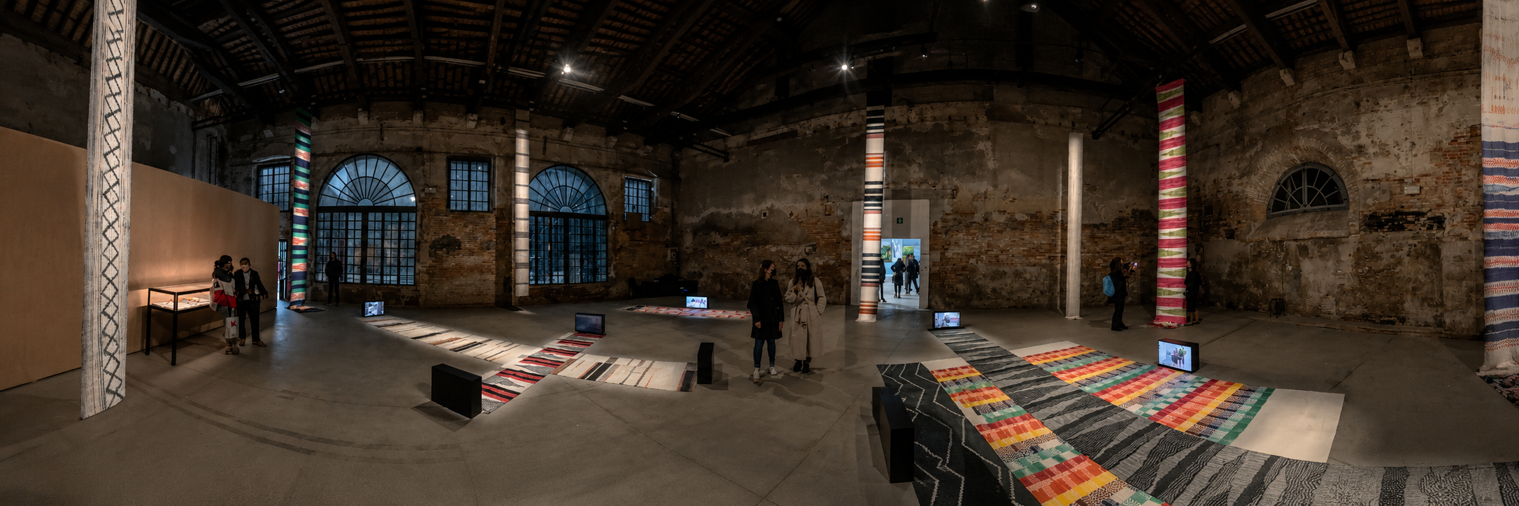 A large, colorful hand-woven tapestry hanging inside the Philippine Pavilion at the Venice Biennale
