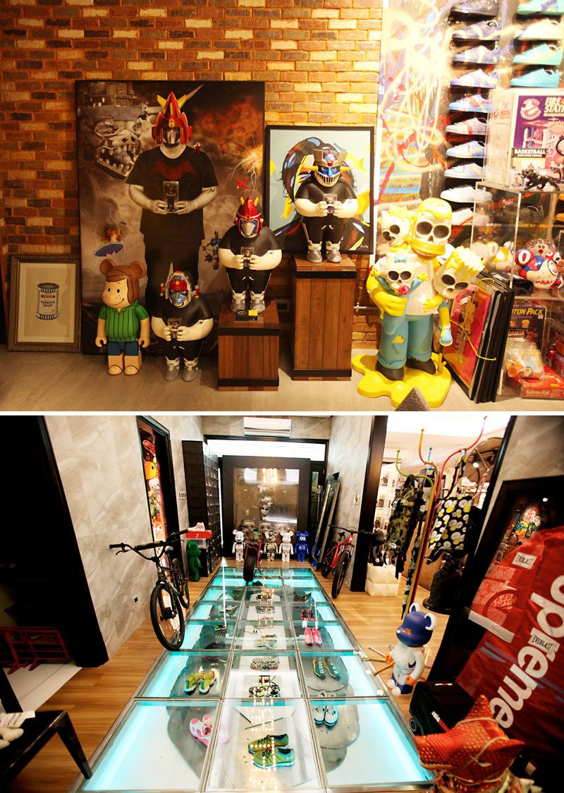 Above, painted portraits and Voltes V-helmeted figures against exposed brick; below, a corridor of sneakers displayed under a lit glass floor