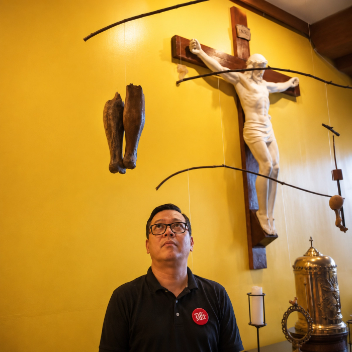 Fr. Jason Dy standing inside the Jesuit Residence chapel in front of his mobile installation Propesiya at Katuparan