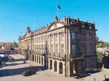 Neoclassical facade of the Pazo de Raxoi town hall in Santiago de Compostela, seen across the Plaza de Obradoiro