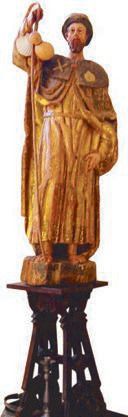 Gilded wooden statue of Saint James with staff, gourds and scallop shells in the Saint Martin Church, Frómista