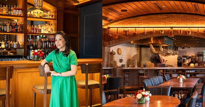 Ana de Ocampo in a green dress at the bar beside a view of Osteria Antica’s wood-vaulted dining room