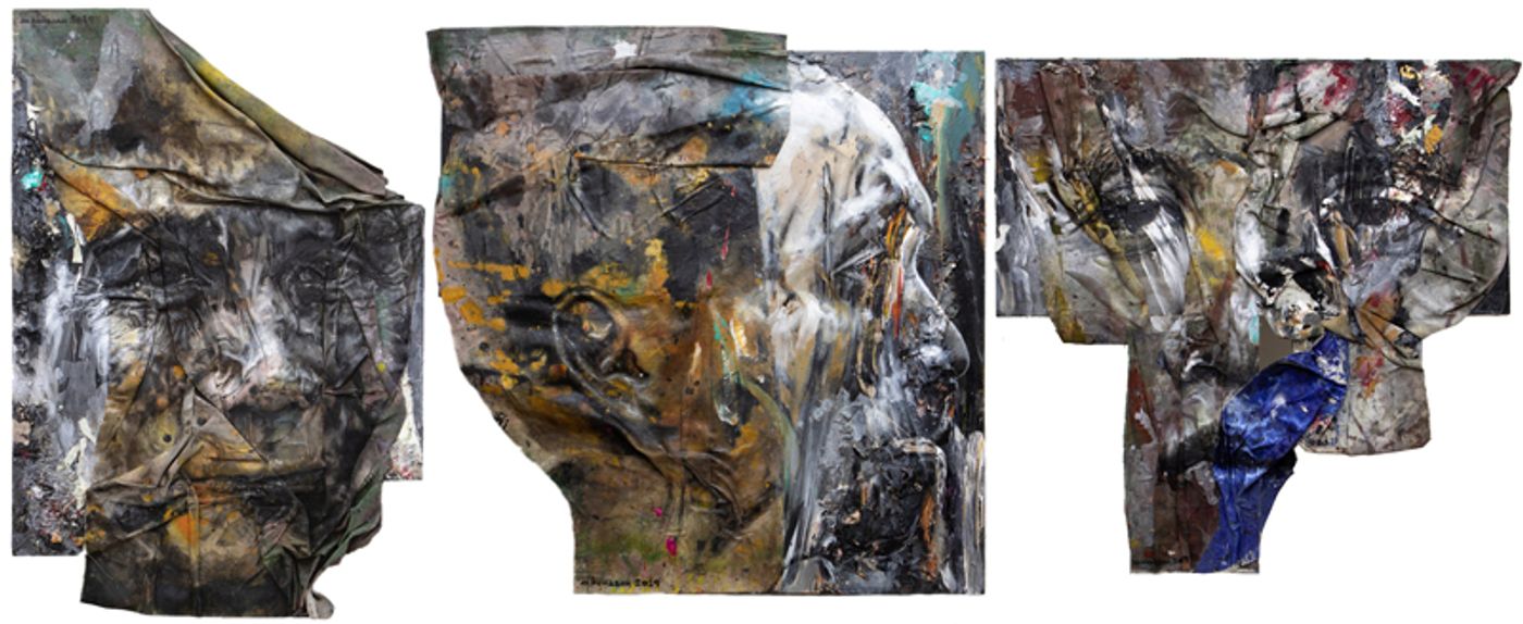 Three large mixed-media portrait heads on crumpled unstretched canvas, worked in greys, ochres and a fold of deep blue