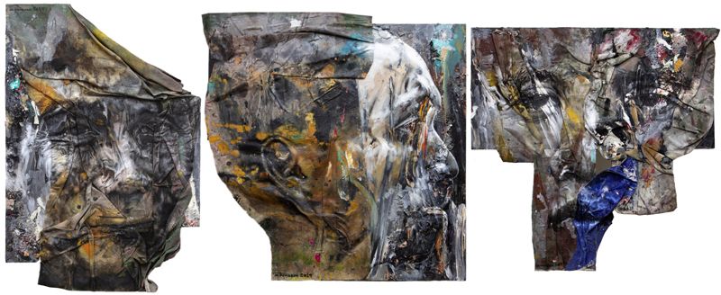 Three large mixed-media portrait heads on crumpled unstretched canvas, worked in greys, ochres and a fold of deep blue