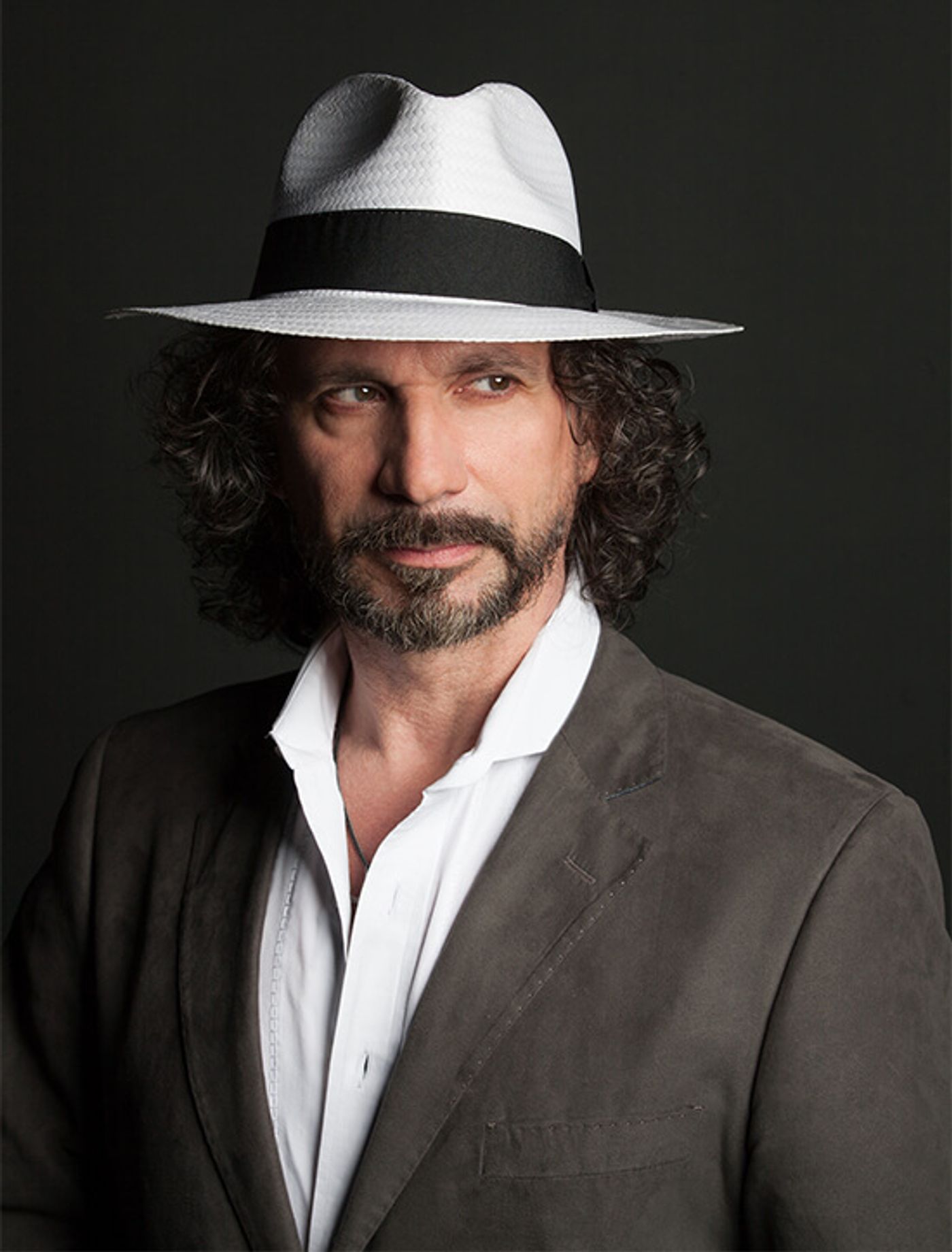 Maestro Fabio Armiliato, celebrated Italian tenor, gesturing as he instructs in a masterclass