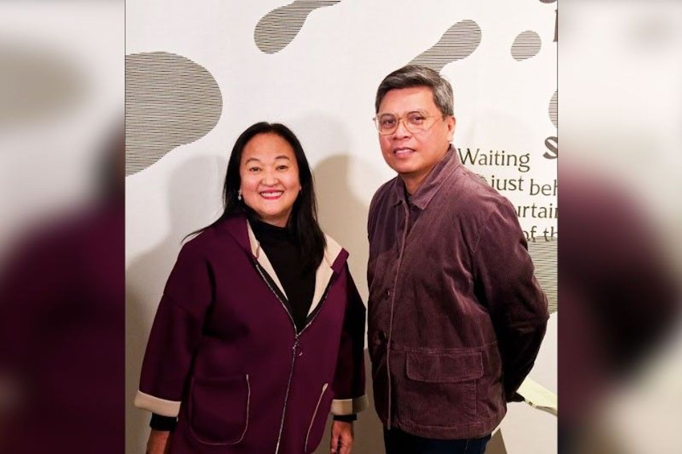 PAVB head Riya Brigino and curator Dr. Patrick Flores smiling inside the exhibition hall