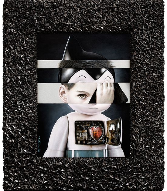 Mixed-media work fusing a boy’s face with an Astro Boy figure, heart circuitry exposed, in a spiky black frame
