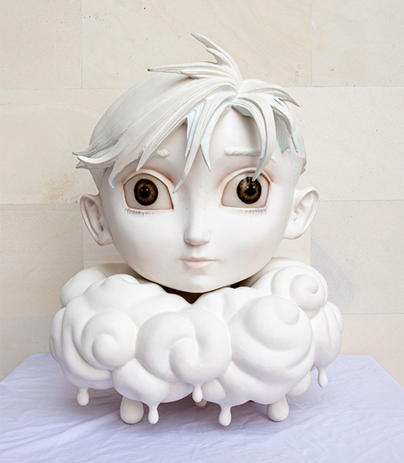 Ronald Ventura’s Rain, a white fiberglass sculpture of an anime boy’s head with wide brown eyes resting on a collar of dripping clouds