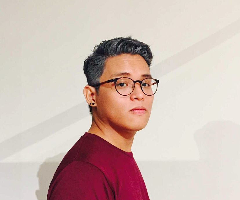 Portrait of Carlos Quijon Jr., curator of the Philippine Pavilion, posing in a dark room