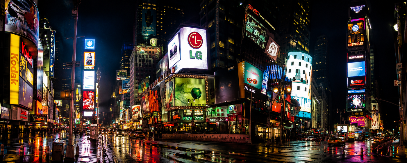 Times Square at night rendered in lurid color, billboards blazing above rain-slicked streets