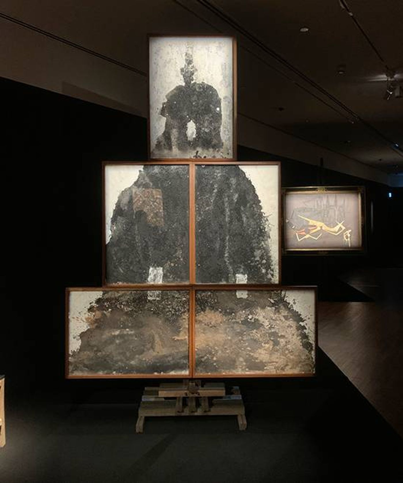 Montien Boonma’s Black Stupa: tiered framed panels of dark, ash-like material stacked into a stupa form