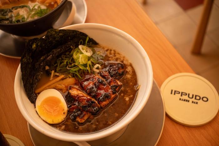 Grilled Chicken Kuro Ramen: dark broth topped with charred chicken, soft egg, nori and scallions