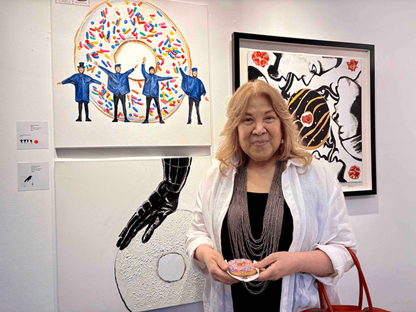 Philippine STAR columnist Lisa Guerrero Nakpil posing in front of a painting at the art opening
