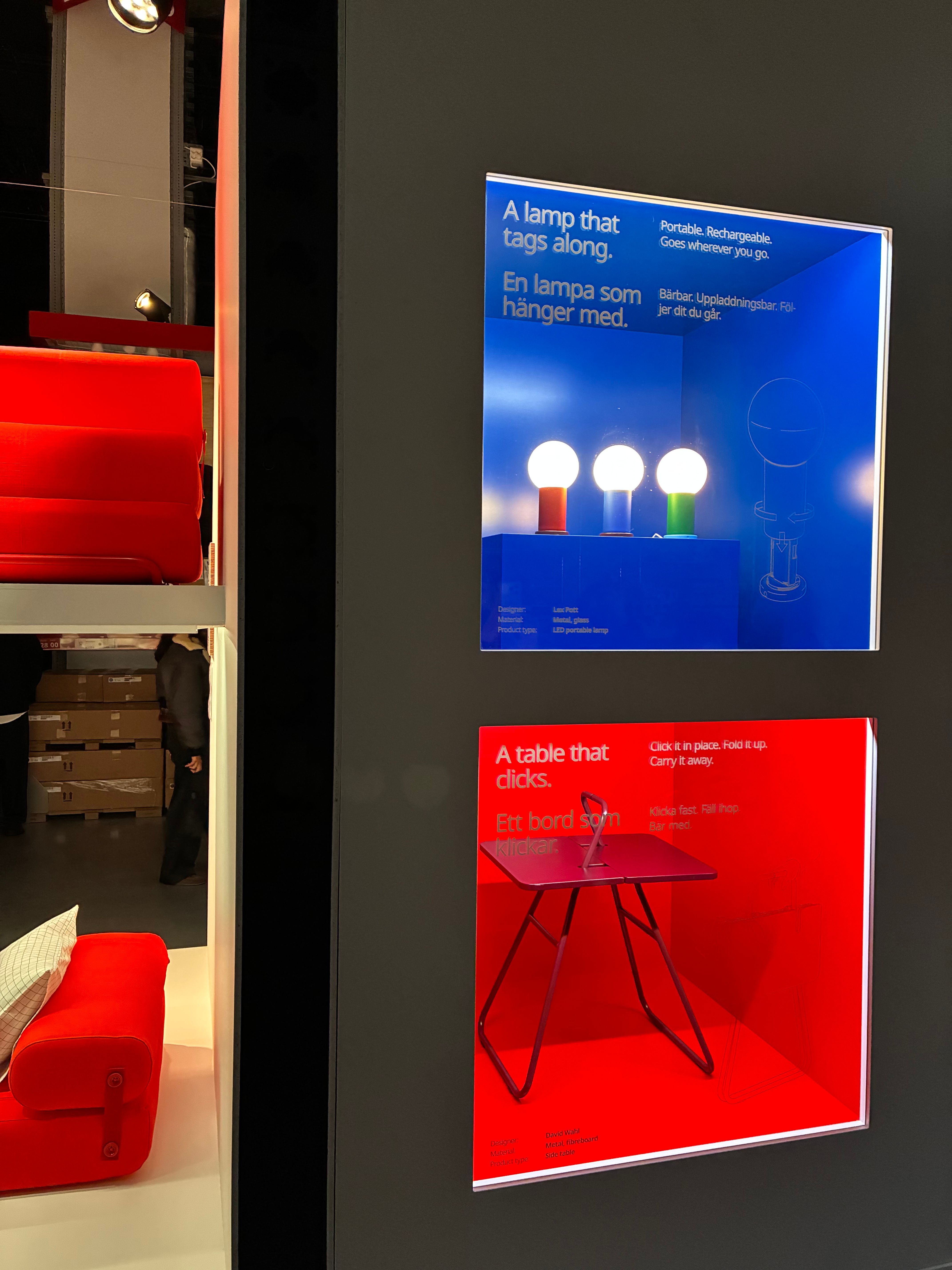 Backlit IKEA PS 2026 display boxes for a portable lamp that tags along and a folding table that clicks, in blue and red