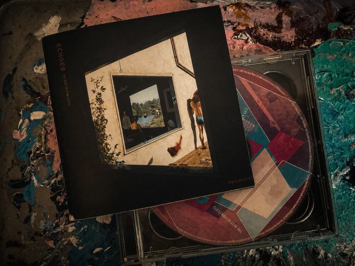 ‘Echoes: The Best of Pink Floyd’ CD, its nested-frames cover art beside the geometric disc in an open jewel case