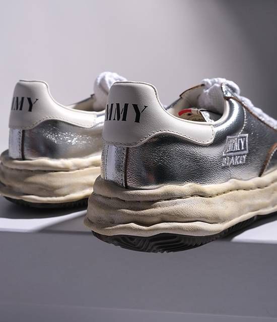 Detailed shot of silver Maison Mihara Yasuhiro Blakey sneaker showcasing the chunky white clay-like textured rubber sole
