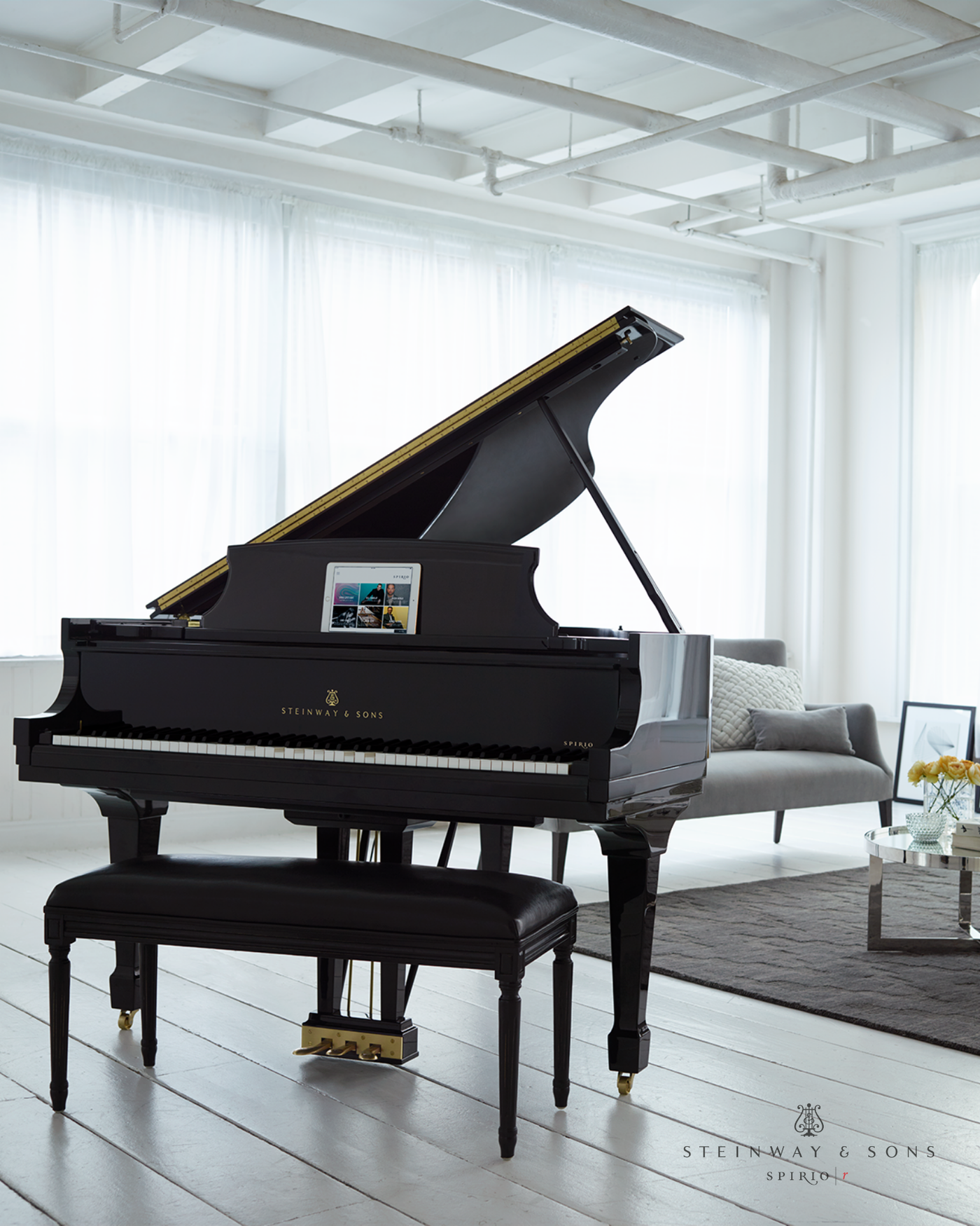Close-up of the Steinway Spirio r high-resolution player grand piano keys and logo