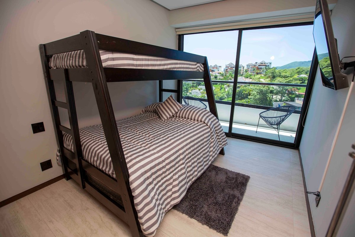 Second bedroom — bunk bed with double lower and single upper berths