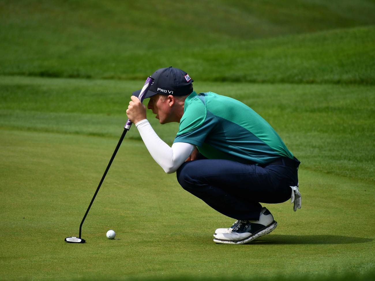 Golfer reading green