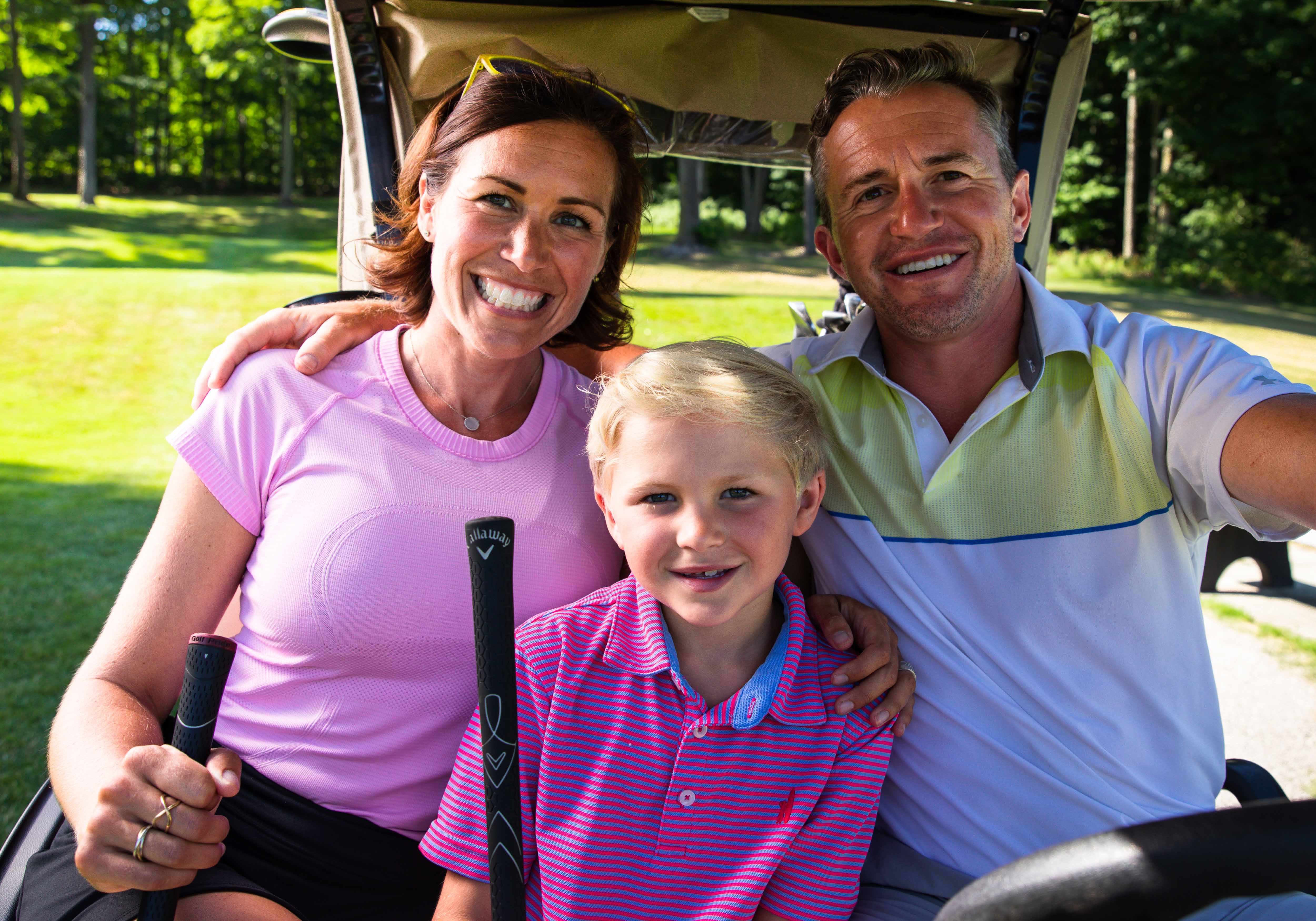 family golfing