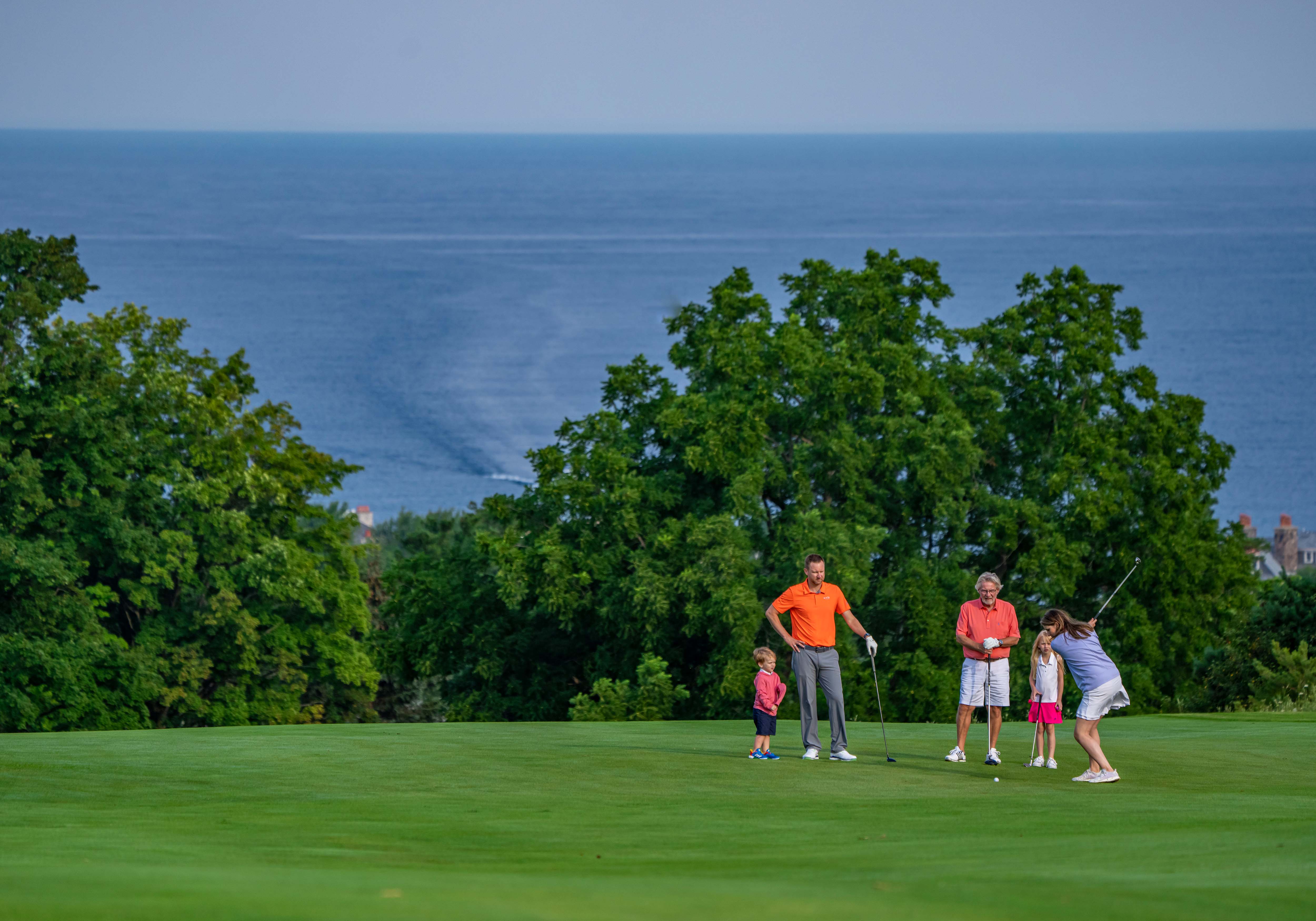 family on golf course