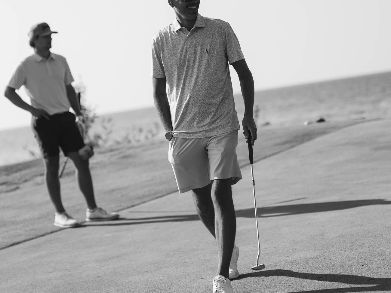 Golfer walking on Links green Bay Harbor Golf Club