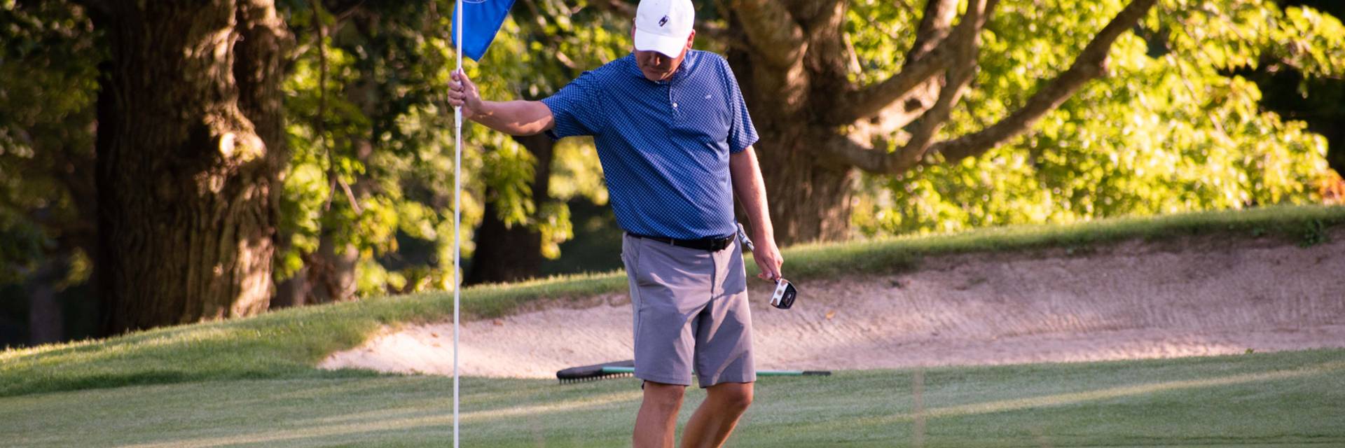 Golfer Placing Pin