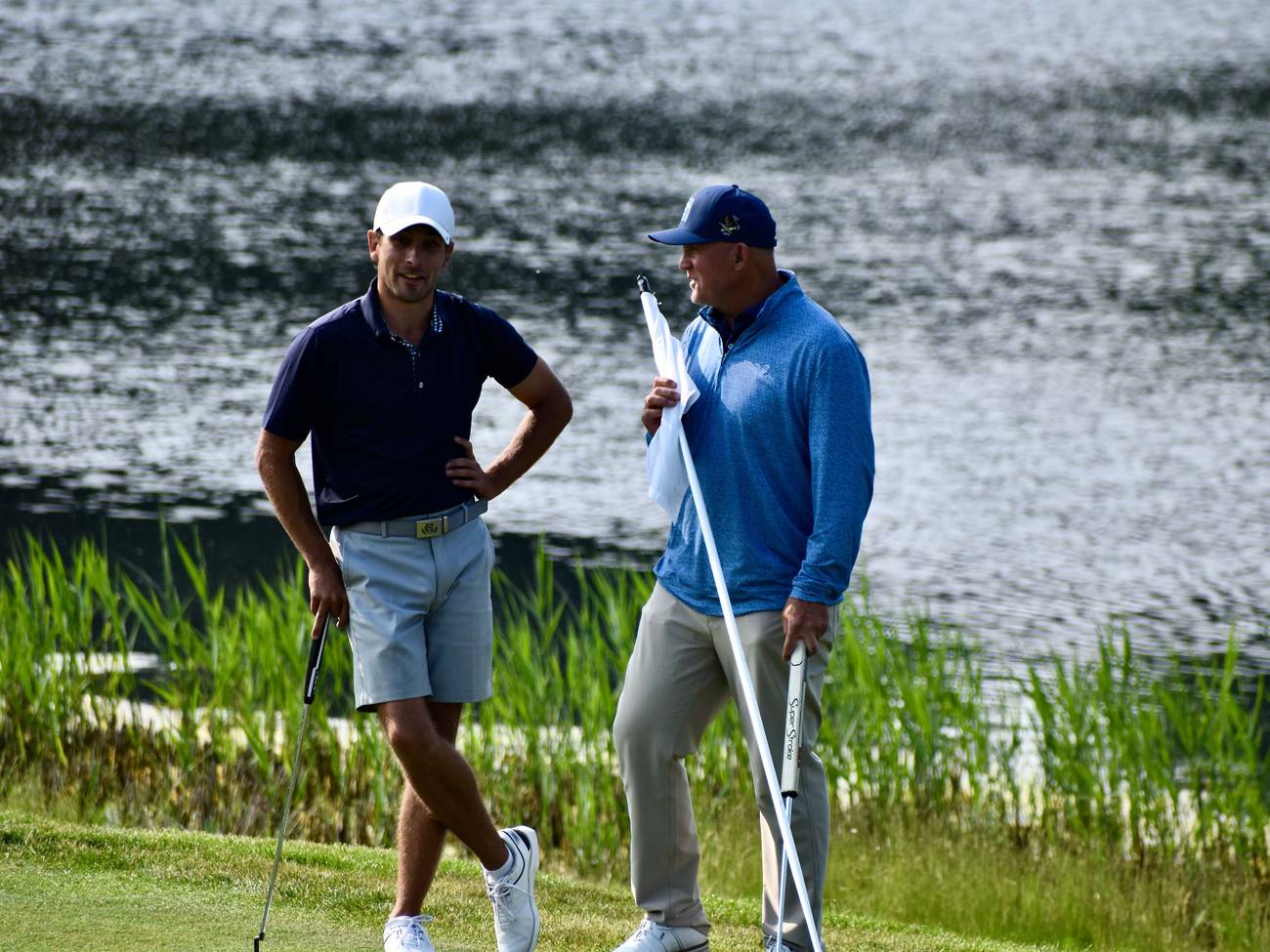 Golfers chatting on the edge of the green