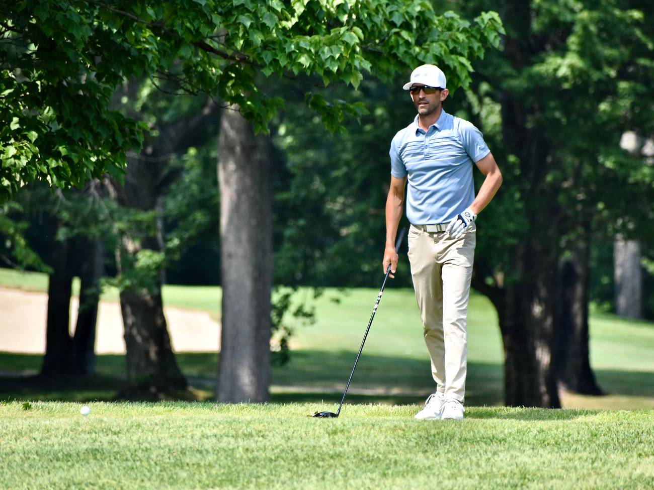 Golfer looking at course