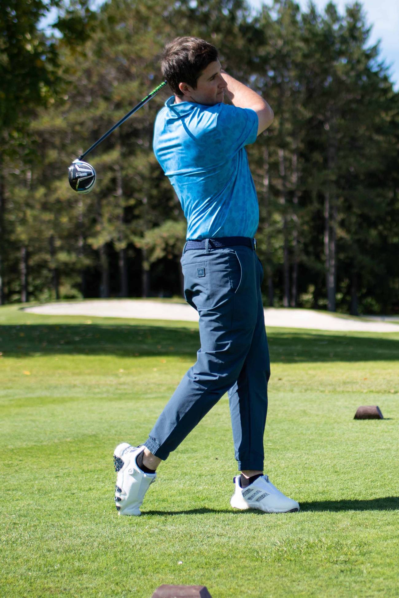 Corey May teeing off