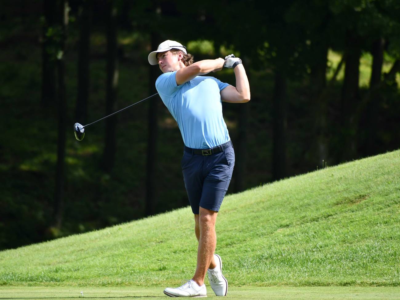Golfer teeing off