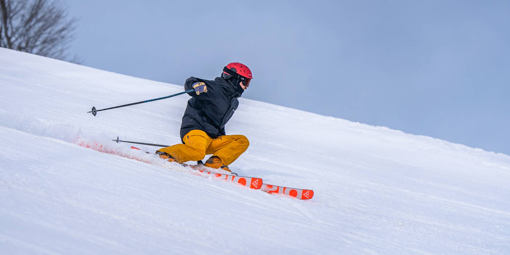 man ripping down slope