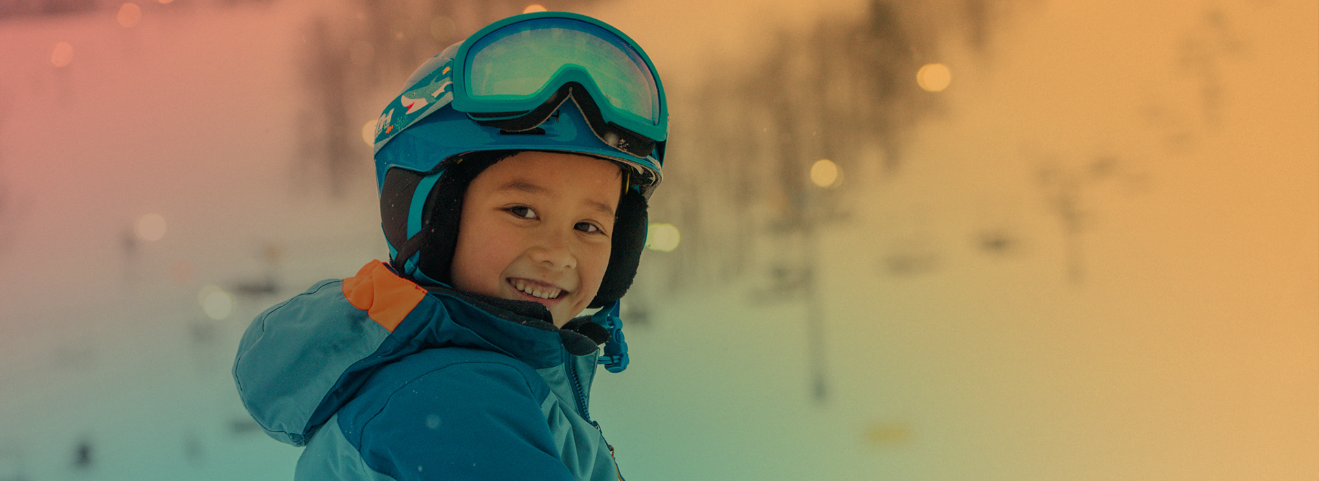 A child in ski gear posing
