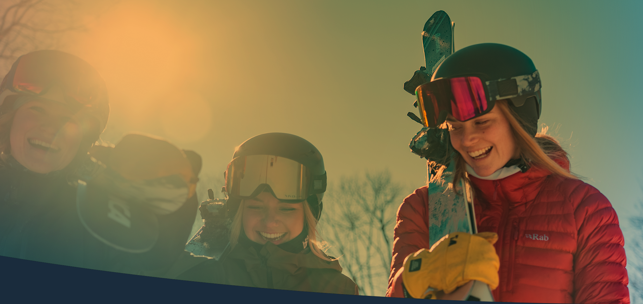 women at top of ski hill