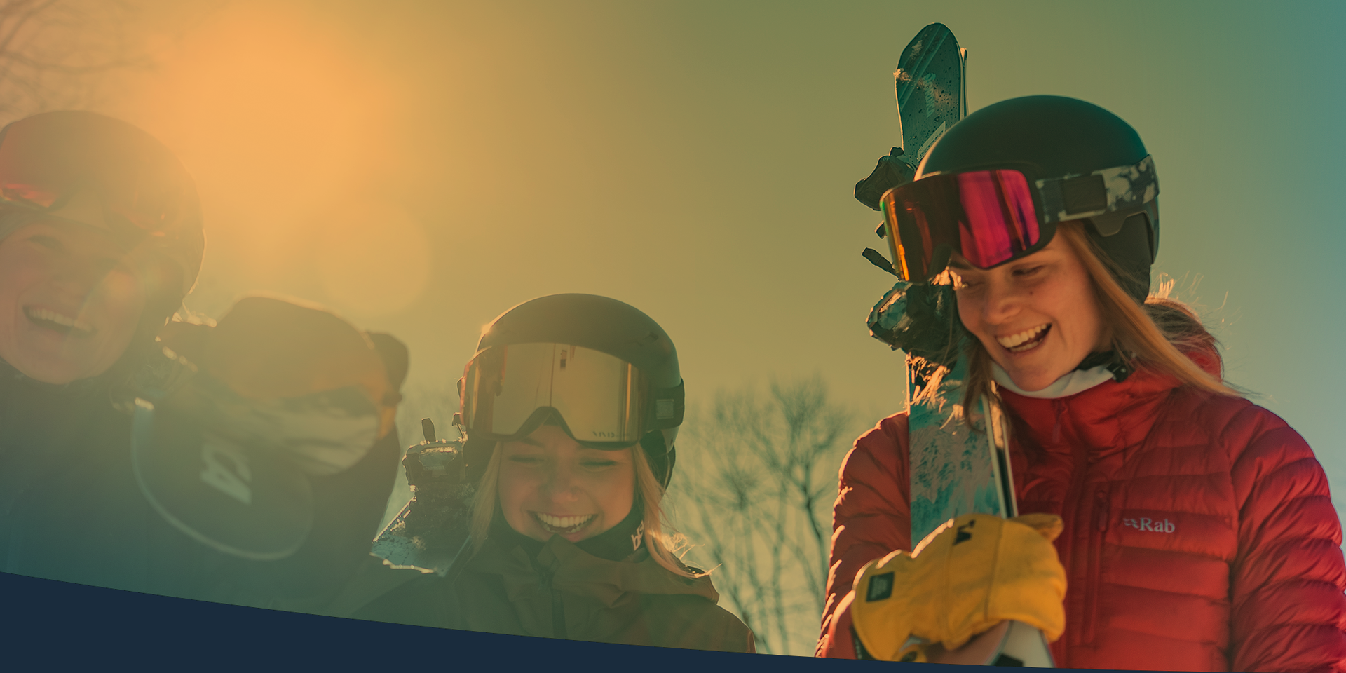 women at top of ski hill