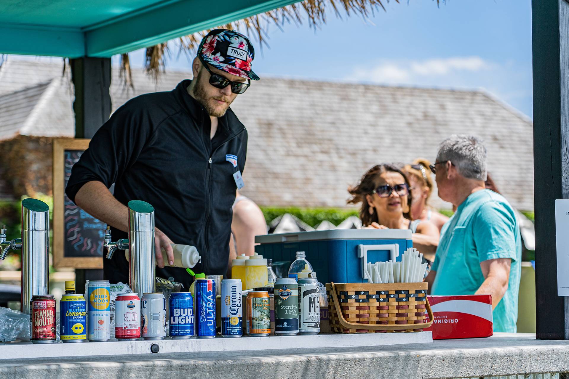 man pouring drinks at the Tiki Bar