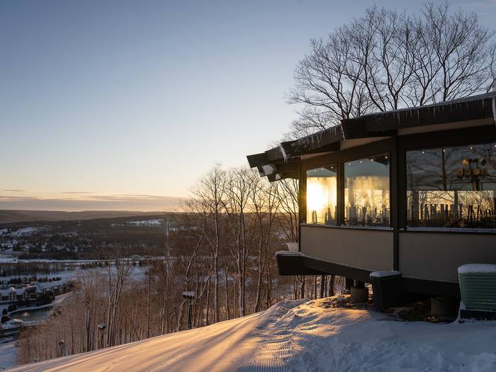 Sunrise through the windows of the eagles nest at boyne mountain