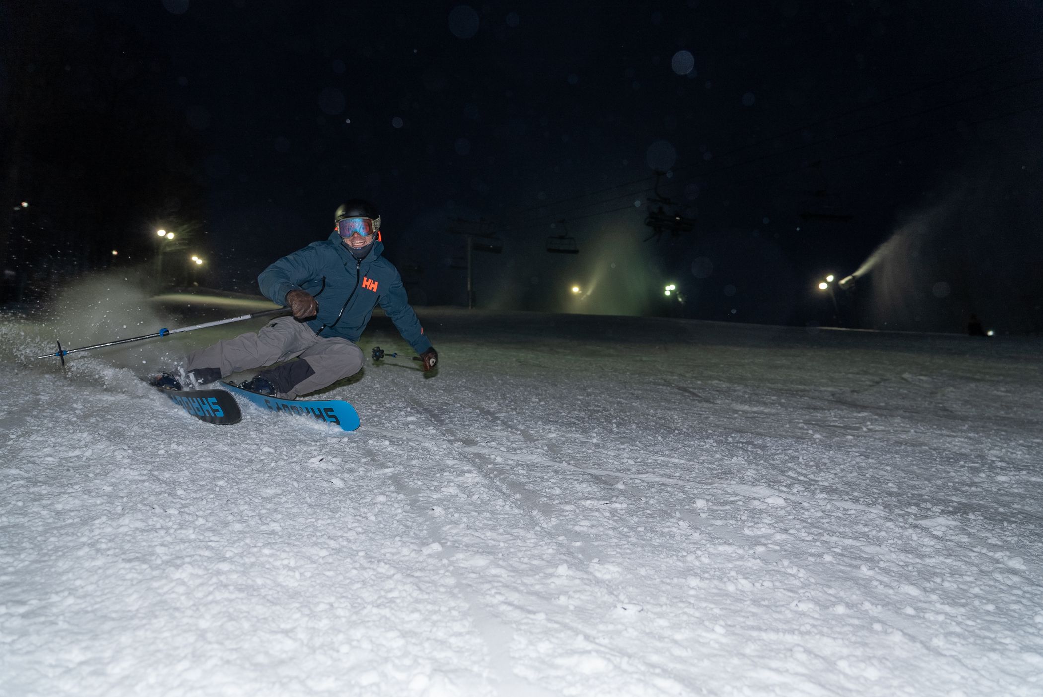 man ripping down slopes at night