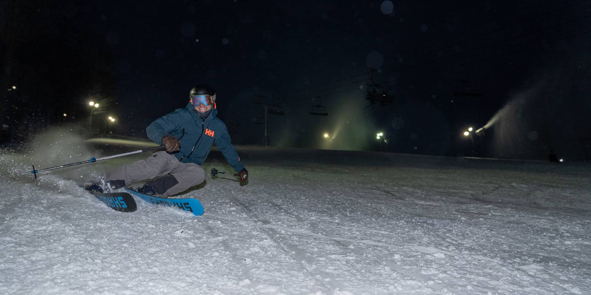 man ripping down slopes at night