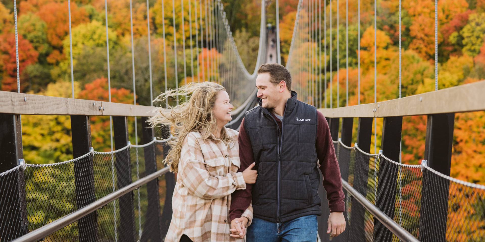 couple smiling on skybridge