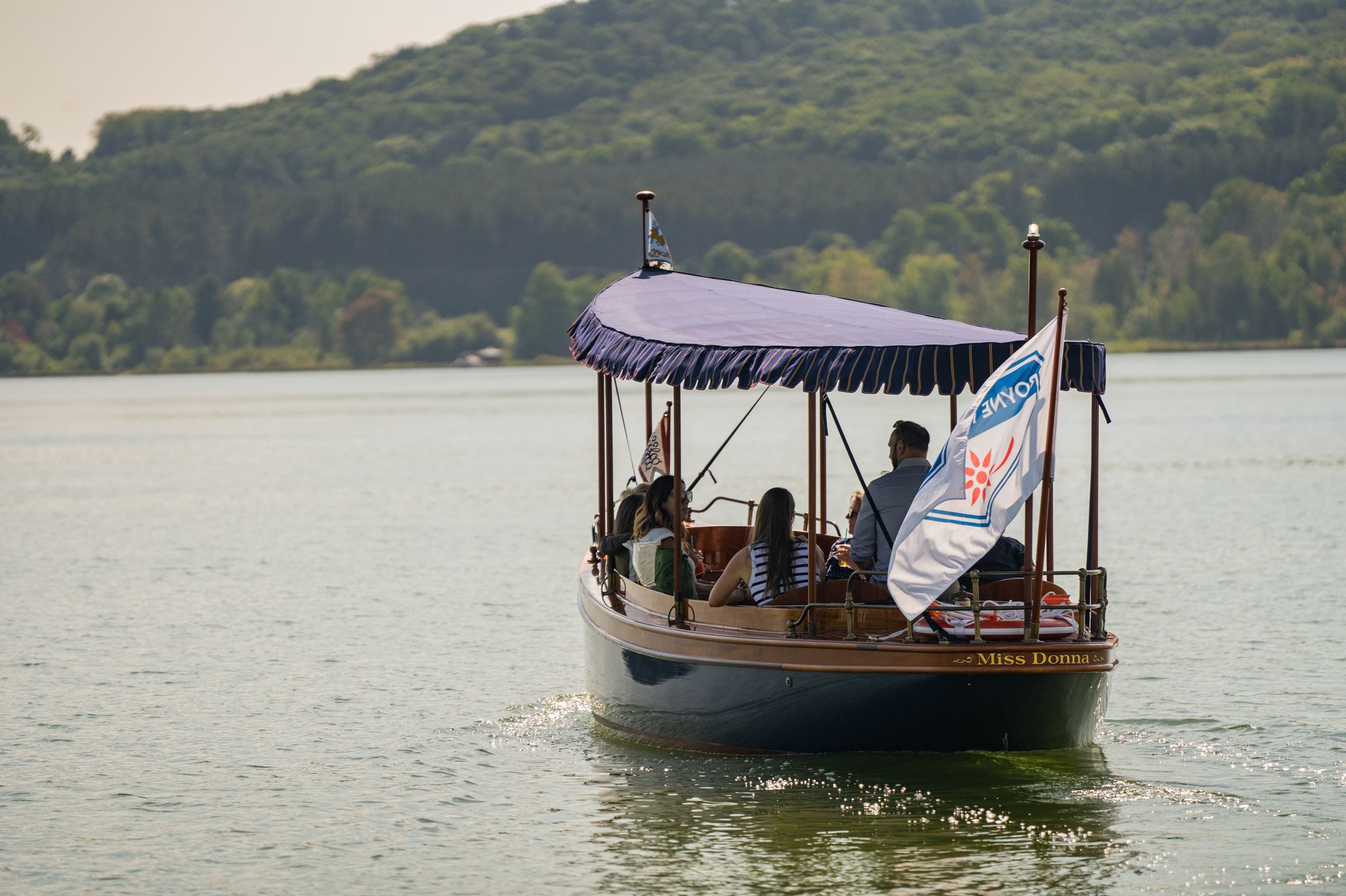 Boat cruising off onto deer lake