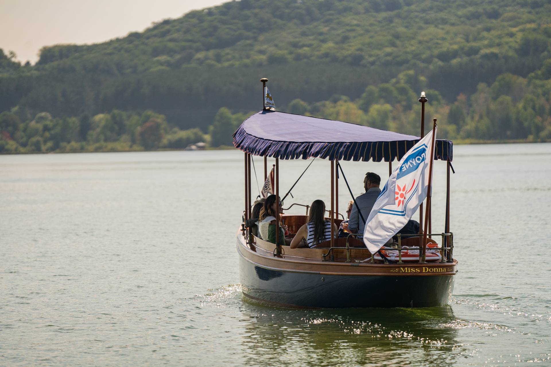 Boat cruising off onto deer lake