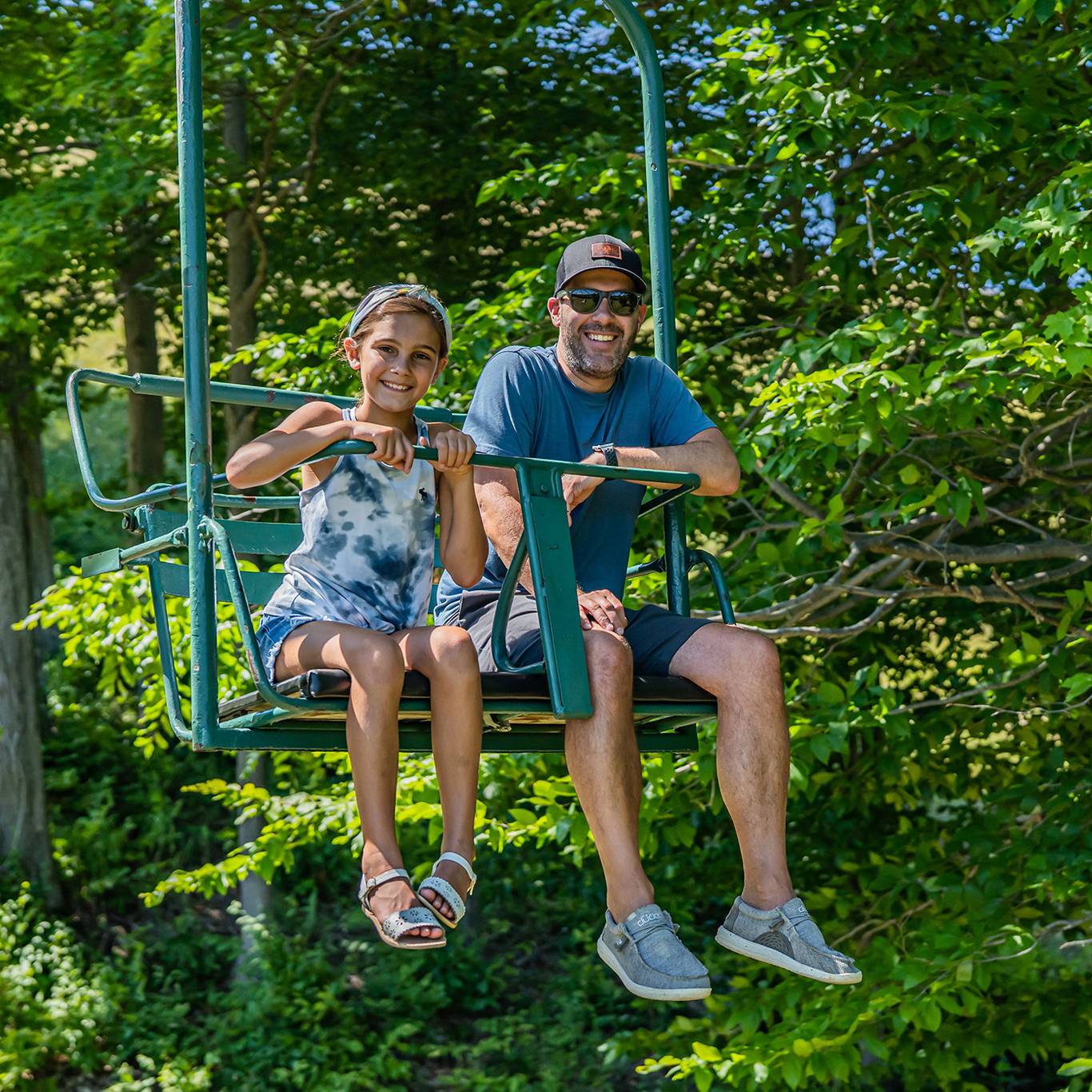 family on scenic chairlift