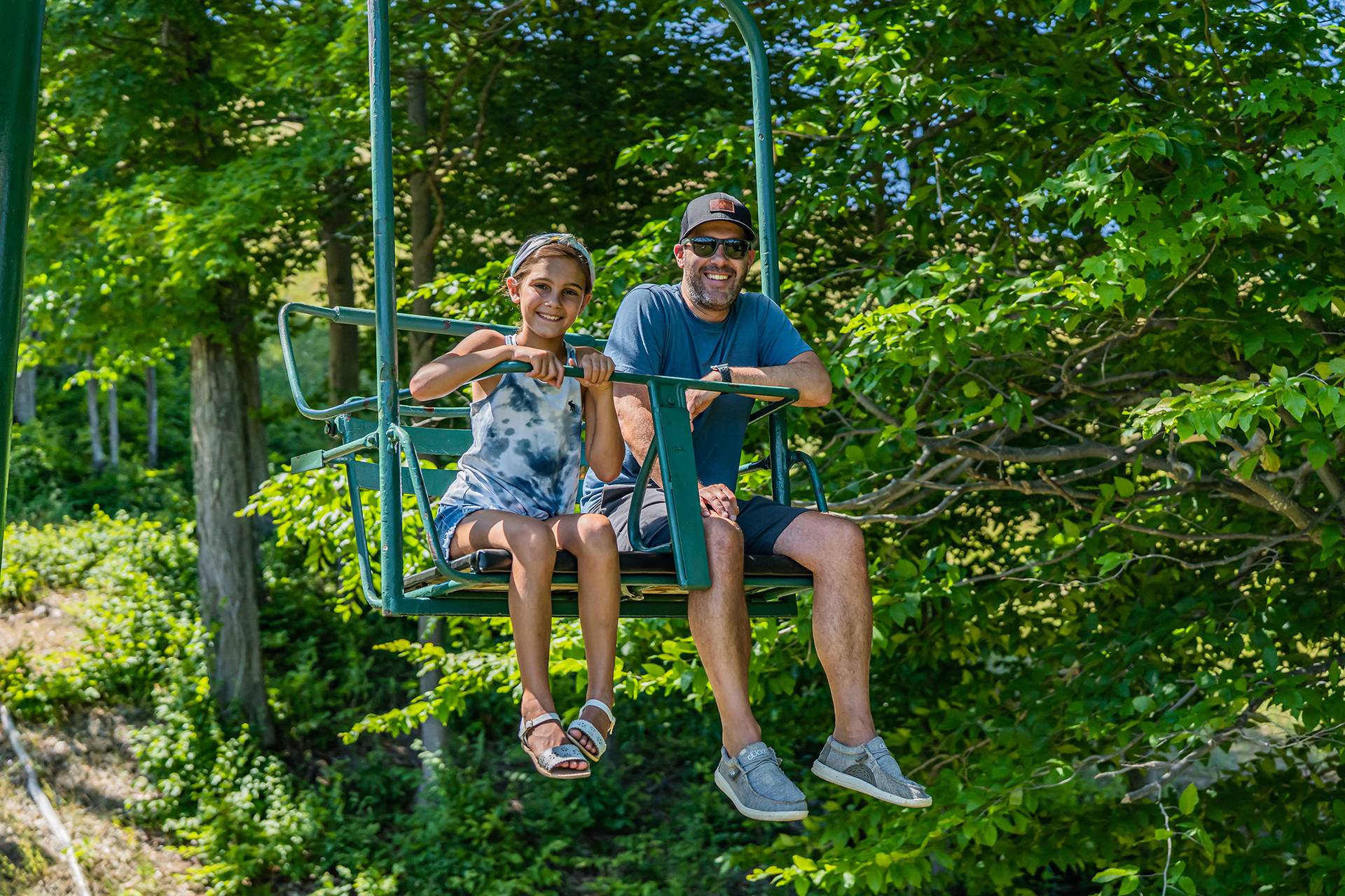 family riding chairlift
