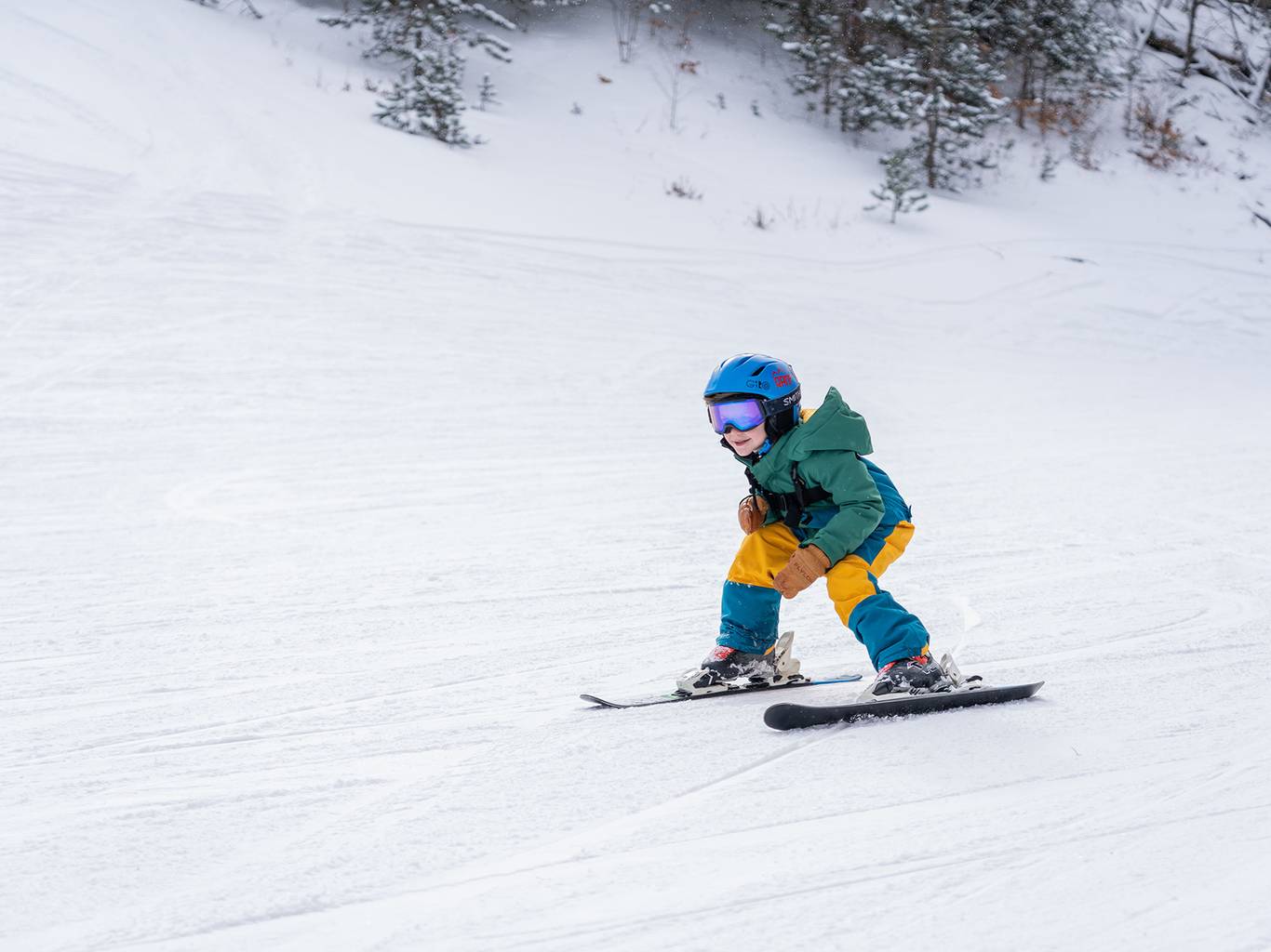 Child racing down ski hill
