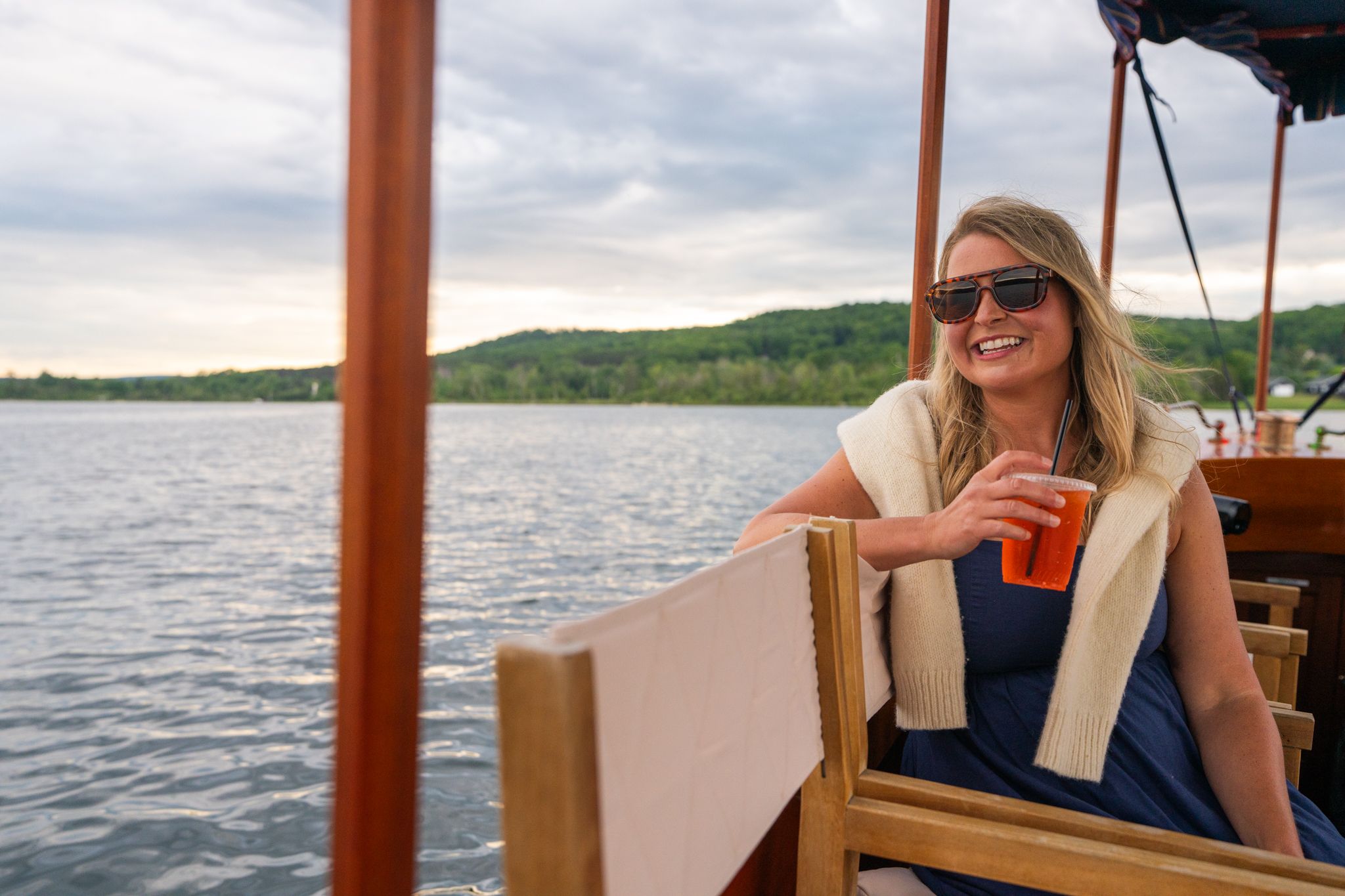 mom with drink on boat