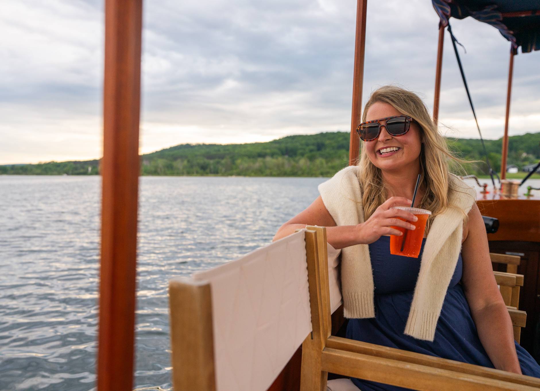 mom with drink on boat