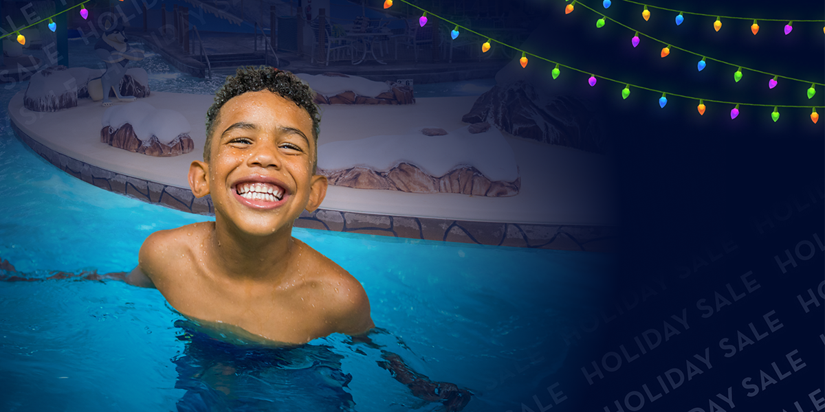 little boy in pool at dark